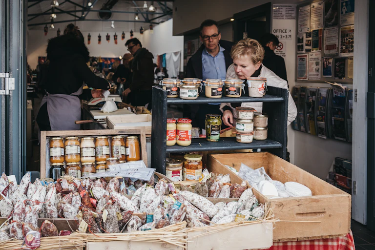People browse products in a deli shop