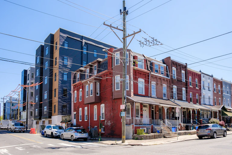A mix of new and old construction on a corner in West Philadelphia