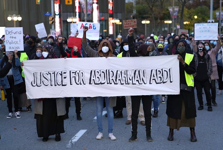 The protestors held a banner reading Justice for Abdul Rahman Abidi.