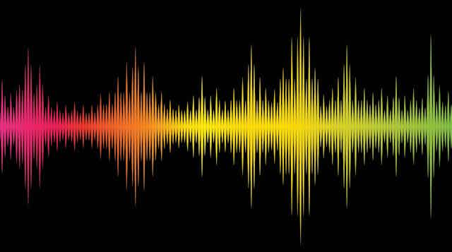 Illustration of a sound wave in multiple rainbow colours against a black background.