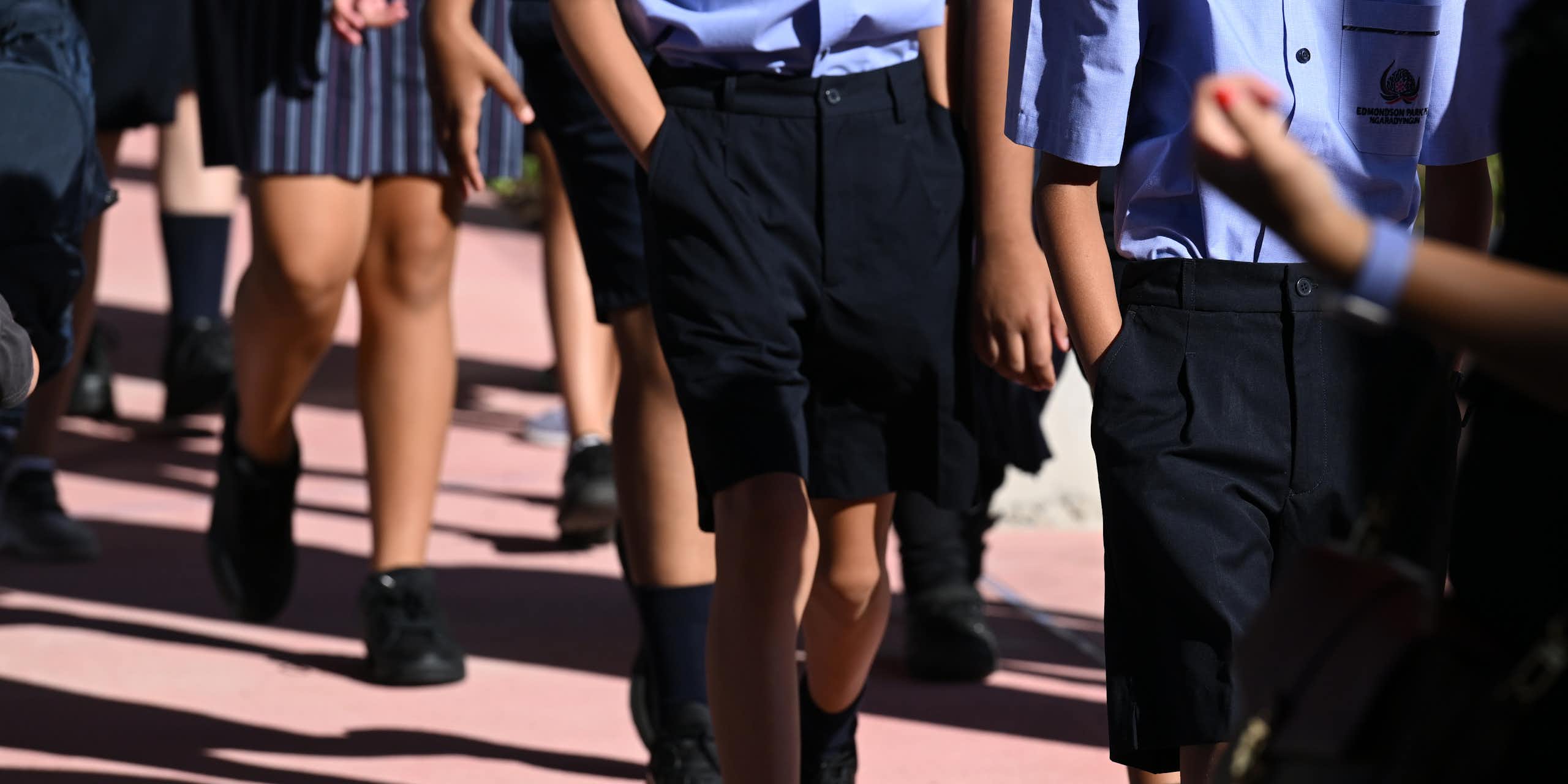 School students in uniform walking