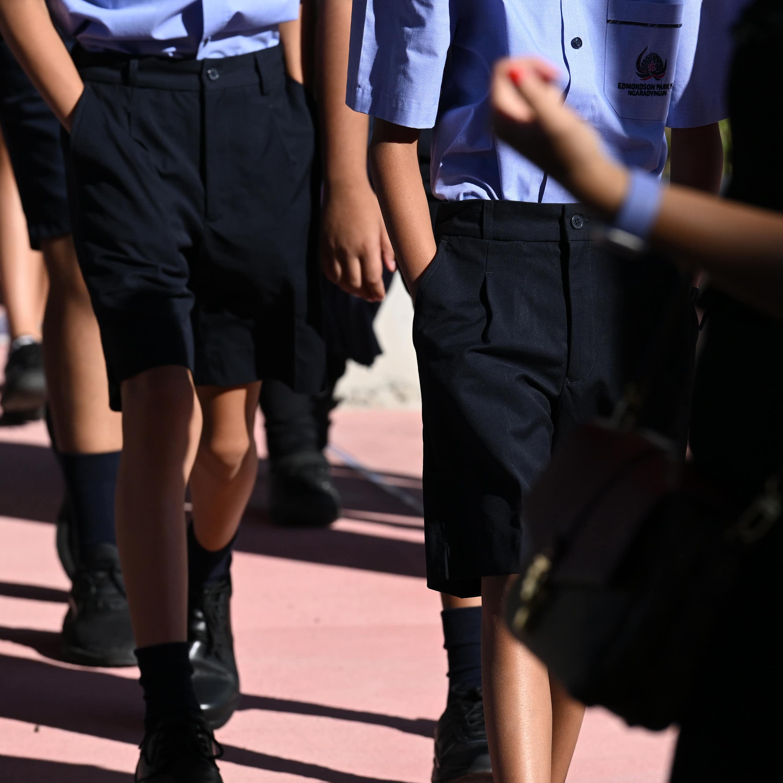 School students in uniform walking