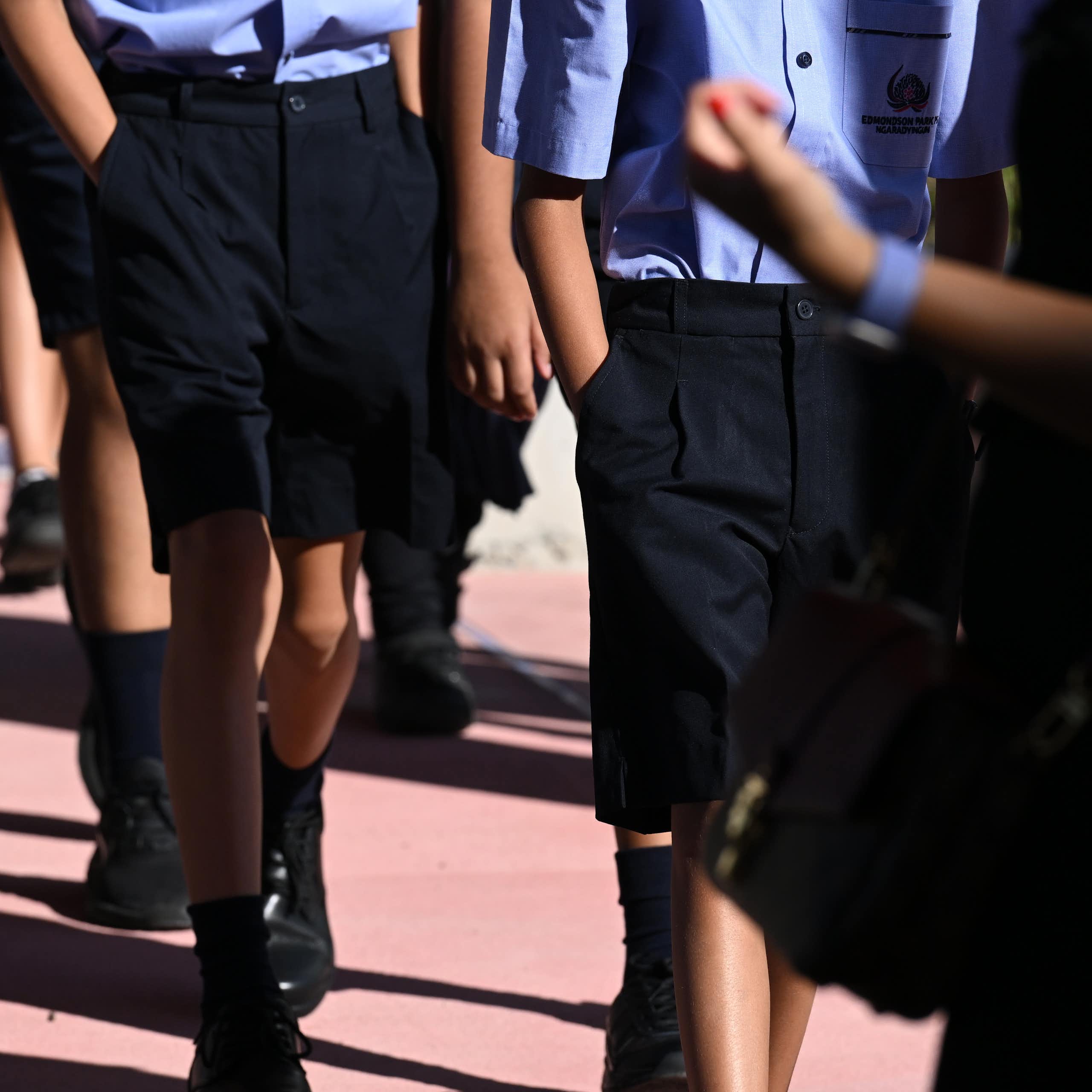 School students in uniform walking 