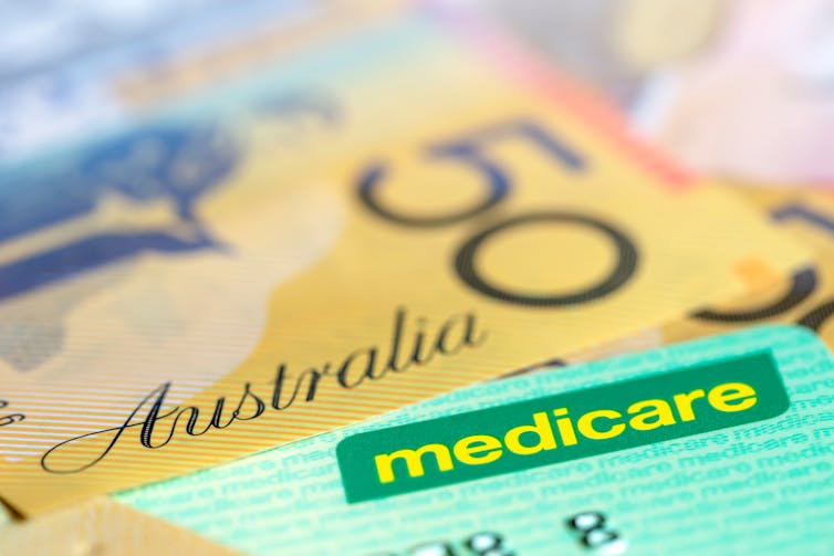 Medicare card and $50 note