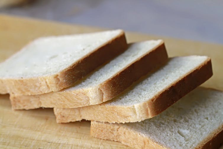 Slices of bread on wooden board