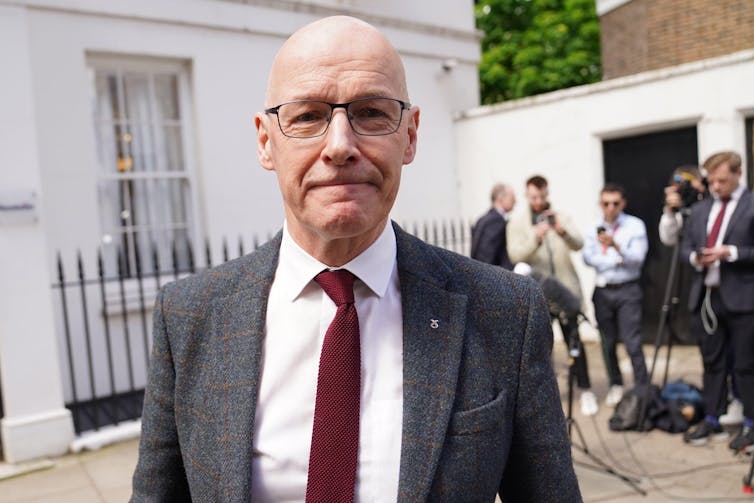 John Swinney, pictured on the street.