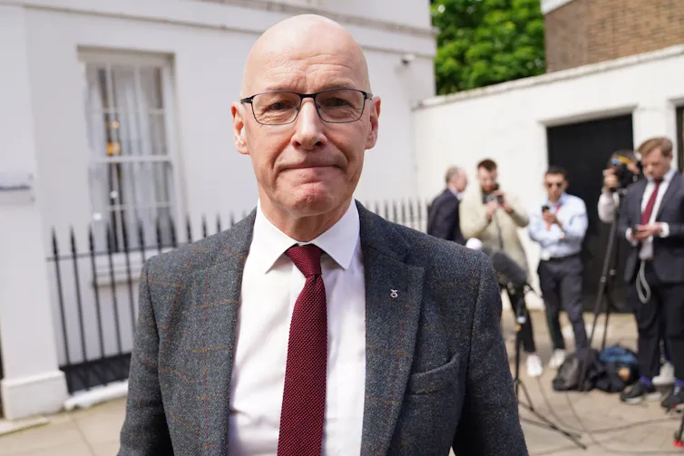 John Swinney, pictured on the street.