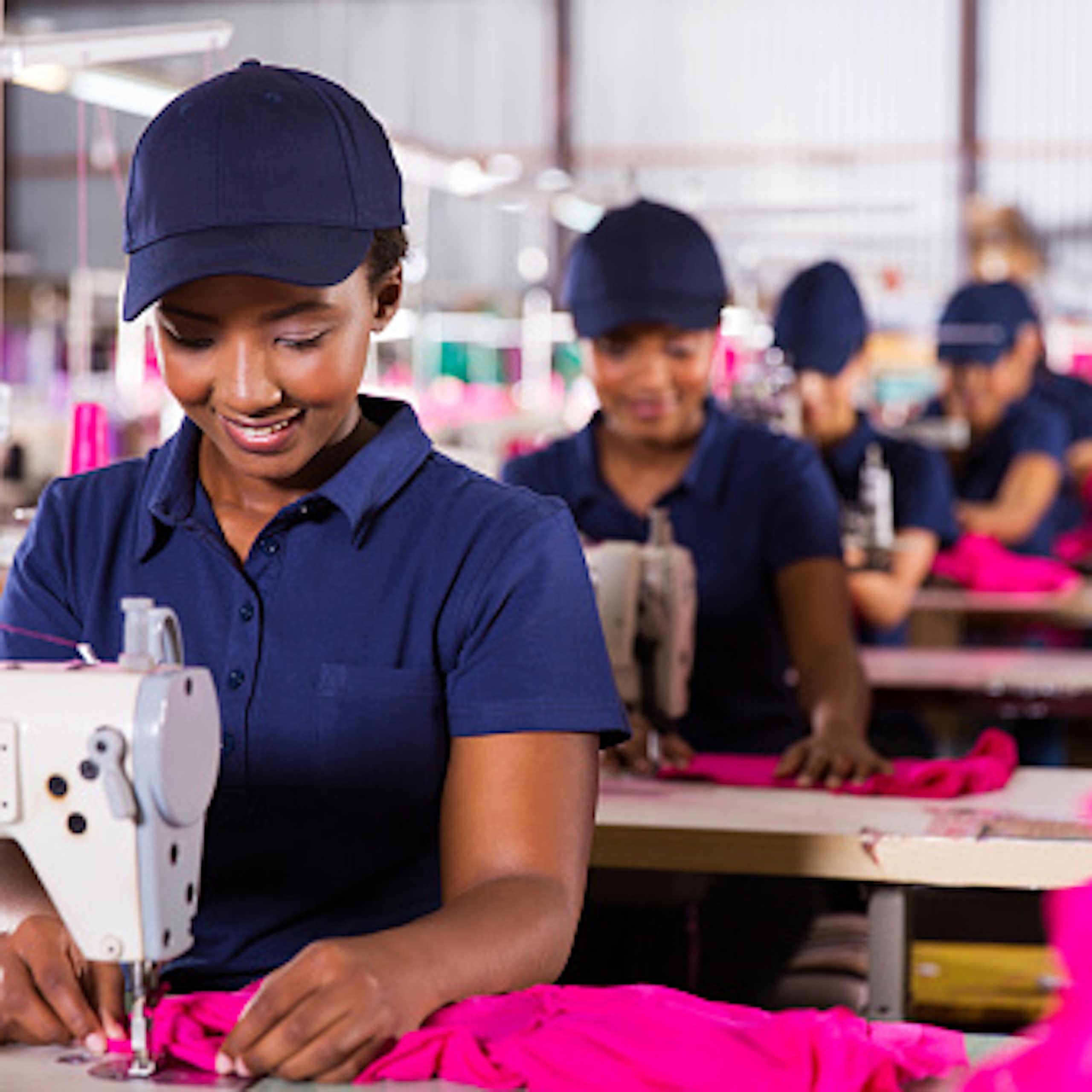 African workers sewing cloths at a textile factory