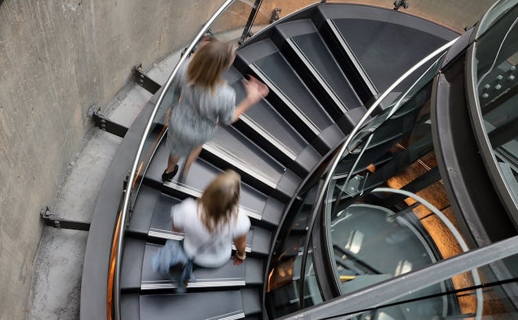 People walking up stairs.