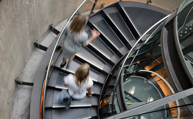 People walking up stairs.