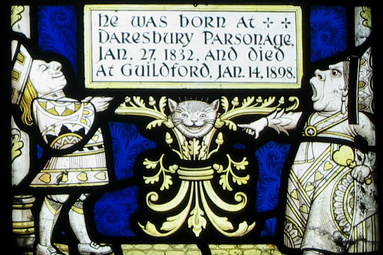 Yellow and white figures of a man and woman in fancy robes and a grinning cat's head.