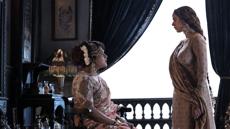 Who were the real courtesans at the heart of Netflix’s Heeramandi? 6 Production image. Two women talking.
