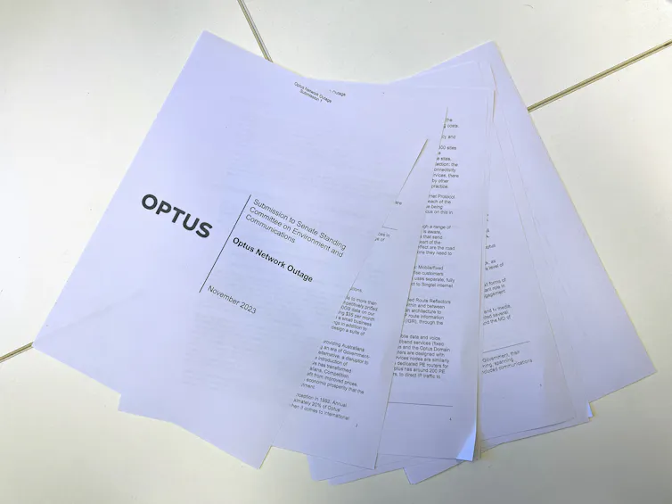 Photo of a sheaf of paper containing a submission to a parliamentary committee regarding the Optus outage.