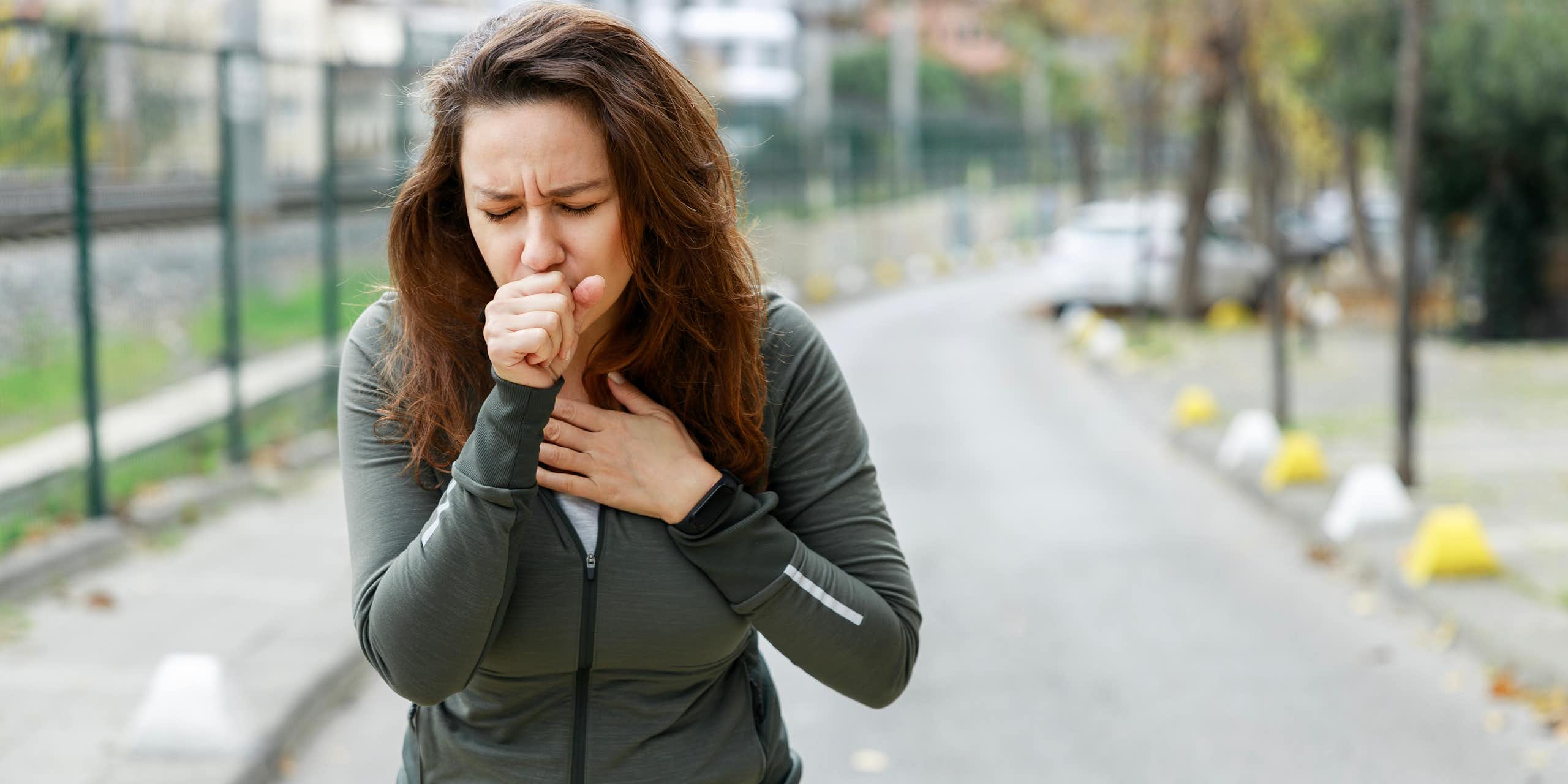 woman running coughing pollution