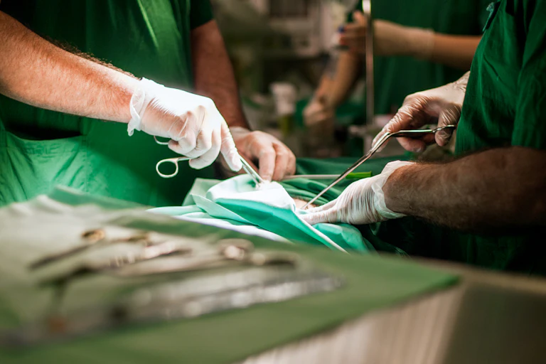 Surgeons operating on patient