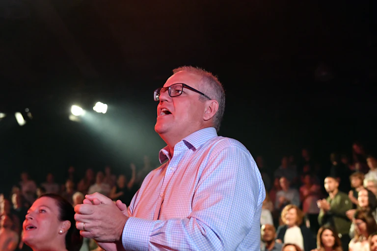 Scott Morrison singing at a church