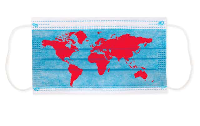 A blue surgical mask with the world map in red