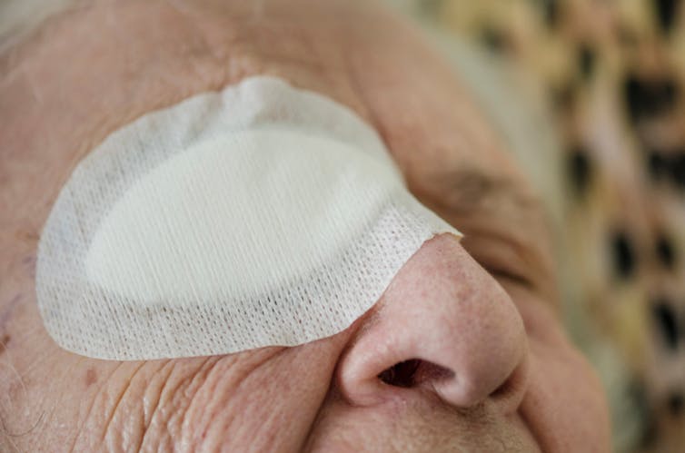 Elderly woman with eye patch