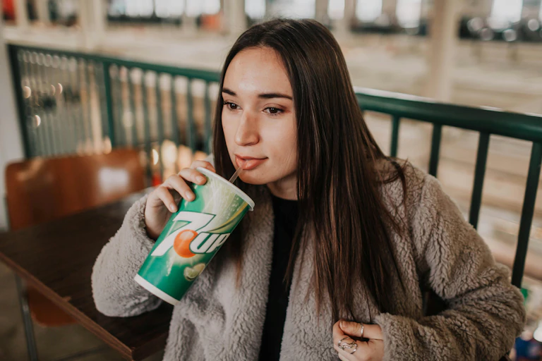 Woman drinks softdrink