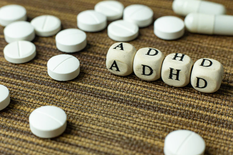 ADHD letters surrounded by pills