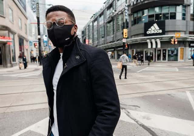 A Black man wearing a face mask.