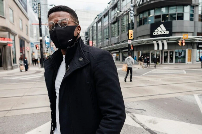 A Black man wearing a face mask.