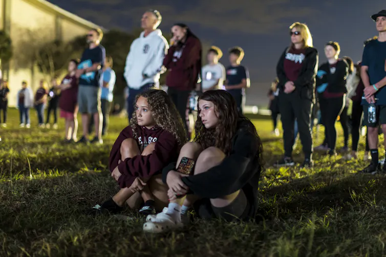 People attend a memorial service on the fifth anniversary of the Marjory Stoneman Douglas High School mass shooting