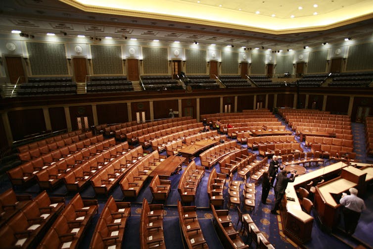 A large room with many rows of empty seats.