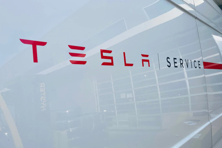 a sign reading TESLA SERVICE