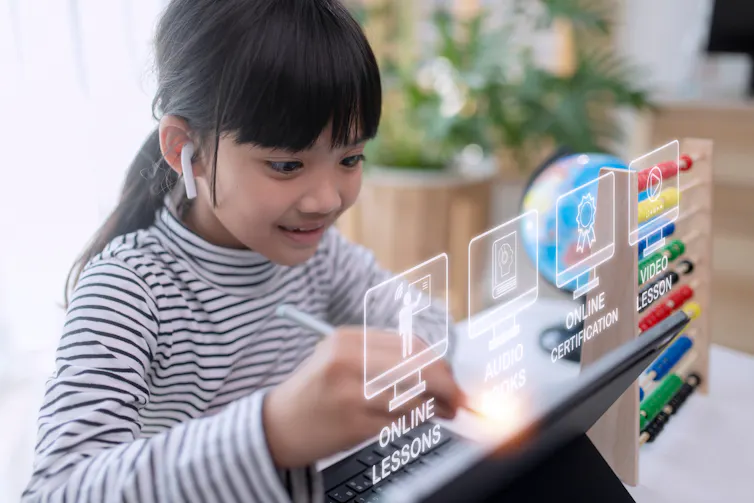 A child with a tech toy.