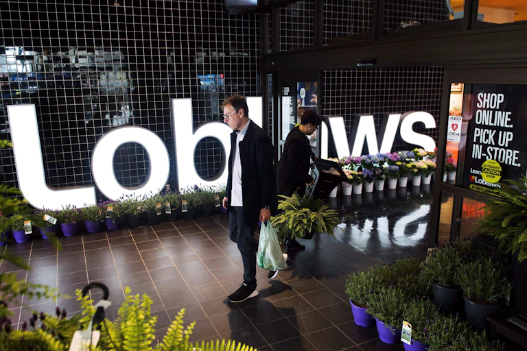 A man walking out of a Loblaws store