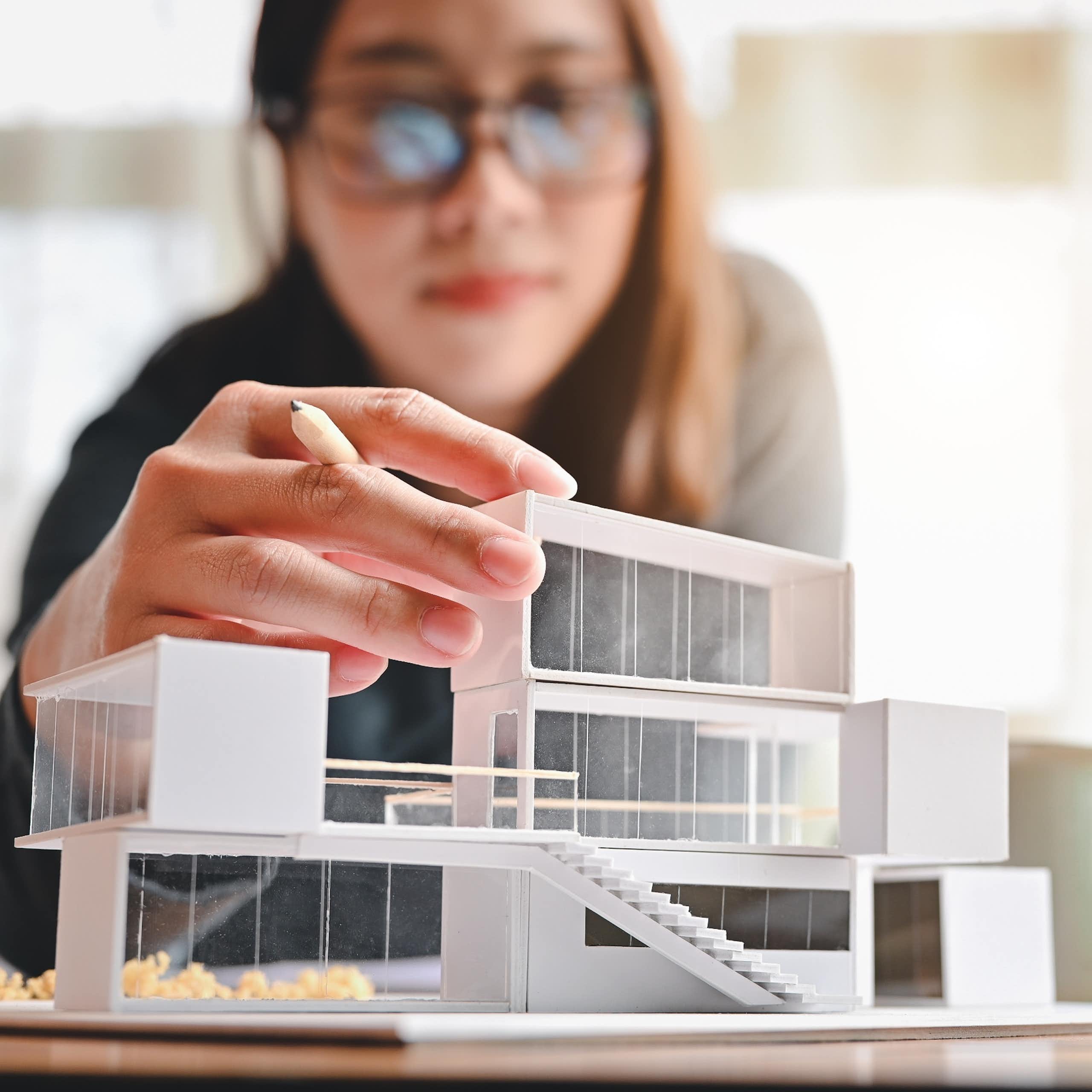 Woman builds an architectural model