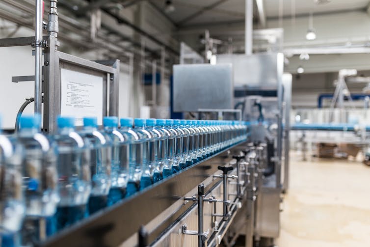 Plastic bottles on a factory assembly line.