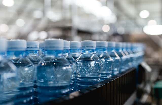 Plastic bottles on an assembly line.