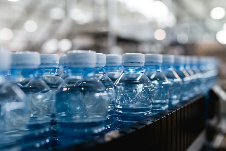 Plastic bottles on an assembly line.