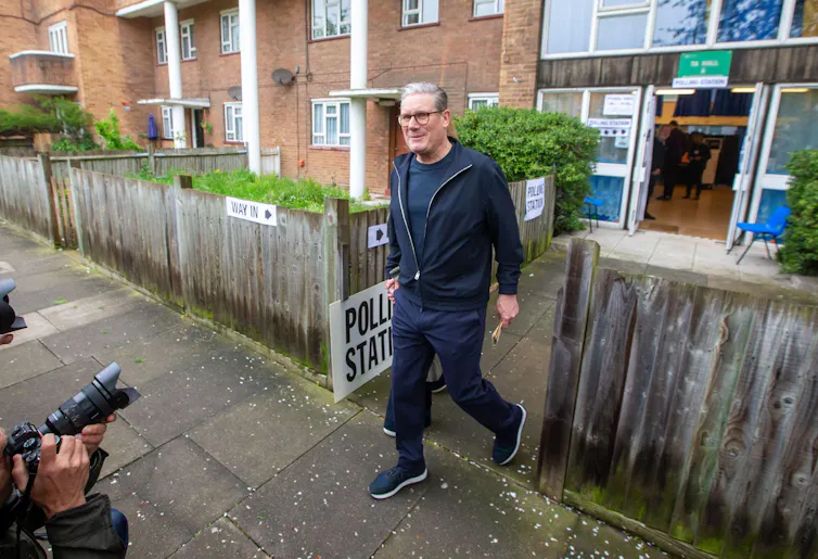Keir Starmer walking out of a polling station.