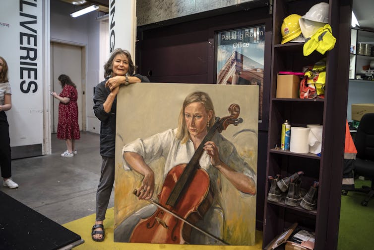 An artist with a painting.
