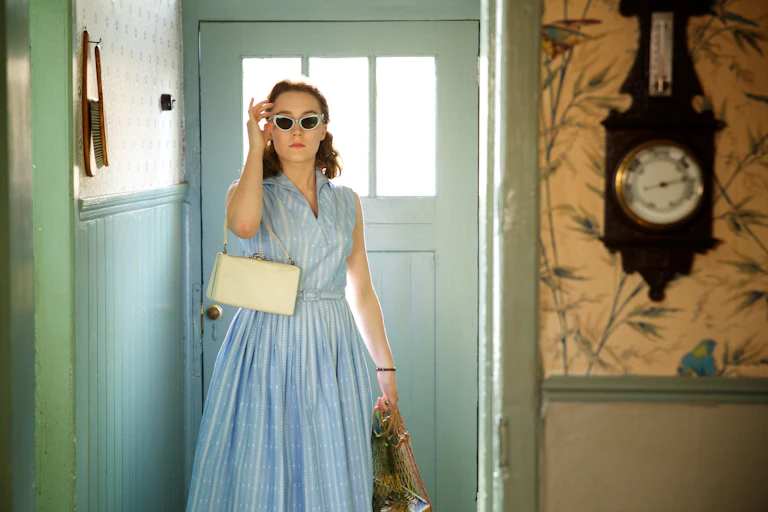 A young woman in a 1950s-style dress.