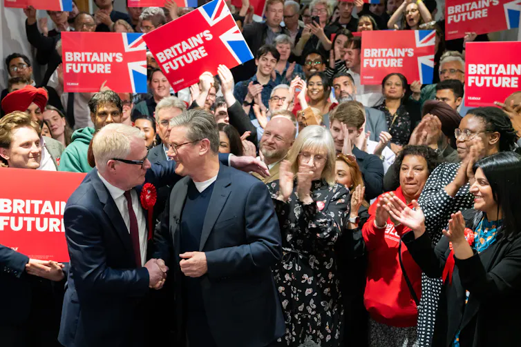 Keir Starmer and Birmingham's new mayor Richard Parker celebrate his election.