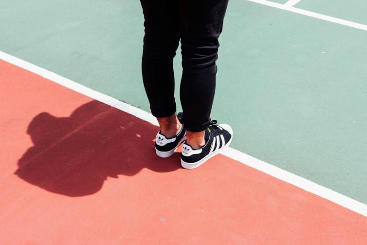 A man stands on the court