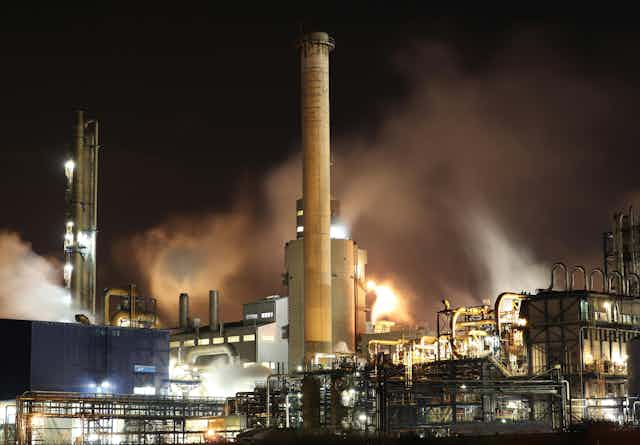 Industrial site with smog billowing from its chimneys