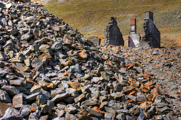 Rocky old mining landscape, green hills in background