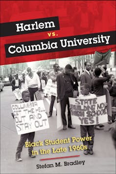 Black protesters, including two small boys in the foreground holding signs urging Columbia University to 'get the hell out and stay out' of Harlem in the 1960s.