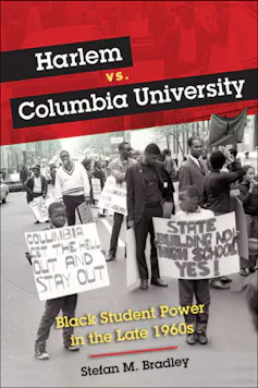 Black protesters, including two small boys in the foreground holding signs urging Columbia University to 'get the hell out and stay out' of Harlem in the 1960s.