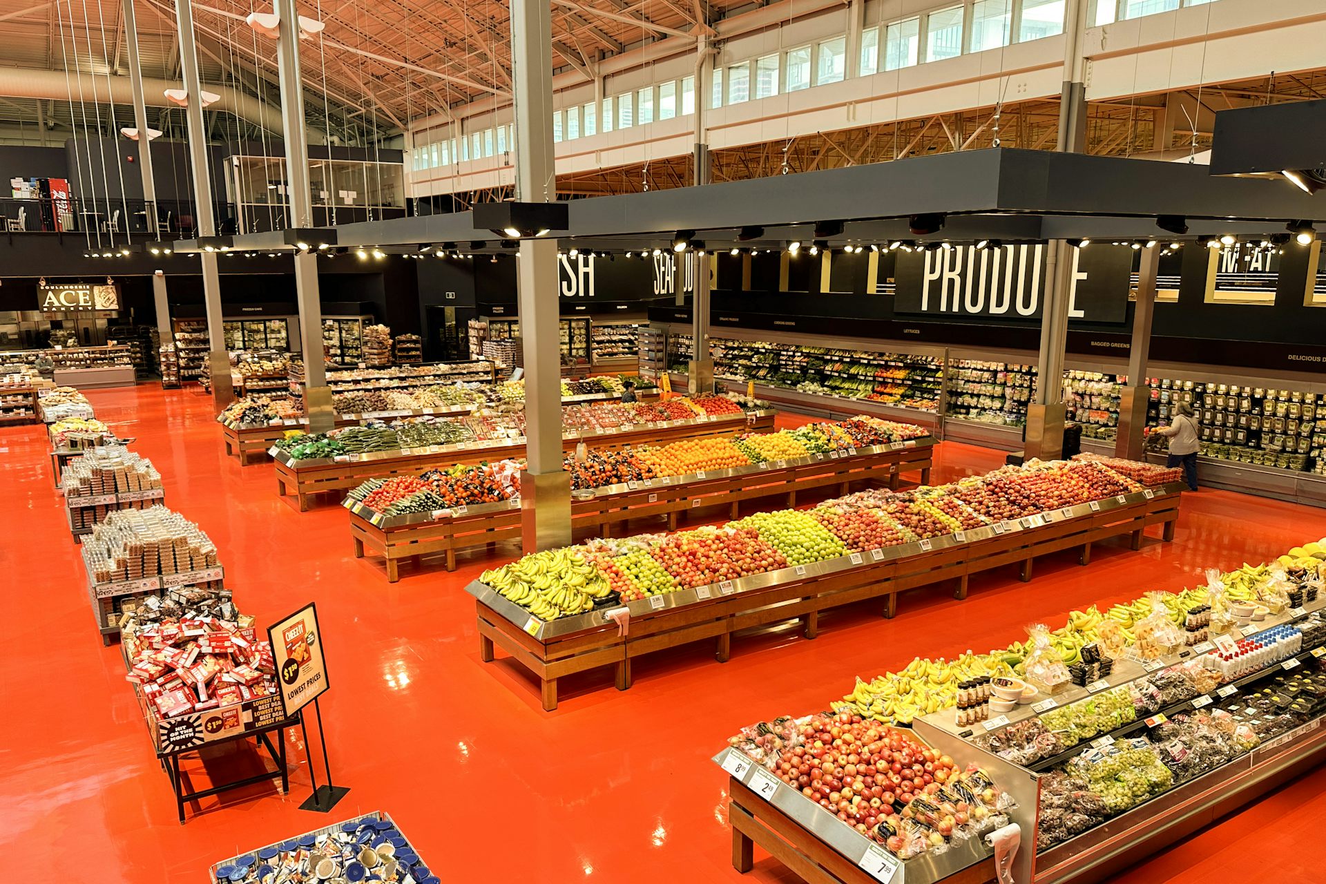 The produce section of a grocery store seen from above