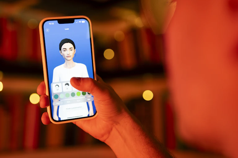 photo shows a user interacting with a smartphone app to customize an avatar for a personal artificial intelligence chatbot