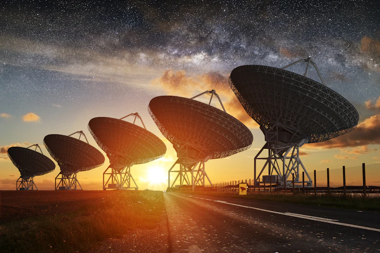 Radio Telescope view at night with milky way in the sky