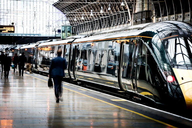 Passengers and train on a station platform