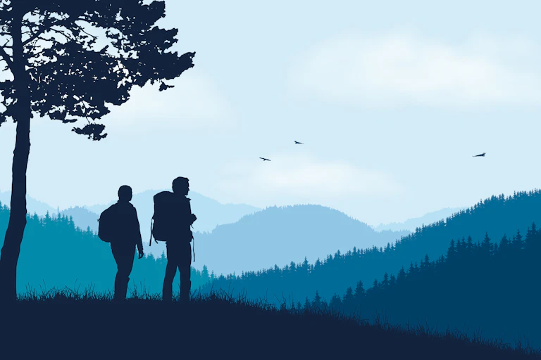 Two hikers in a landscape.