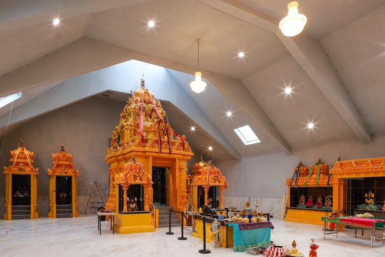 The interior of a cinema converted into a temple.